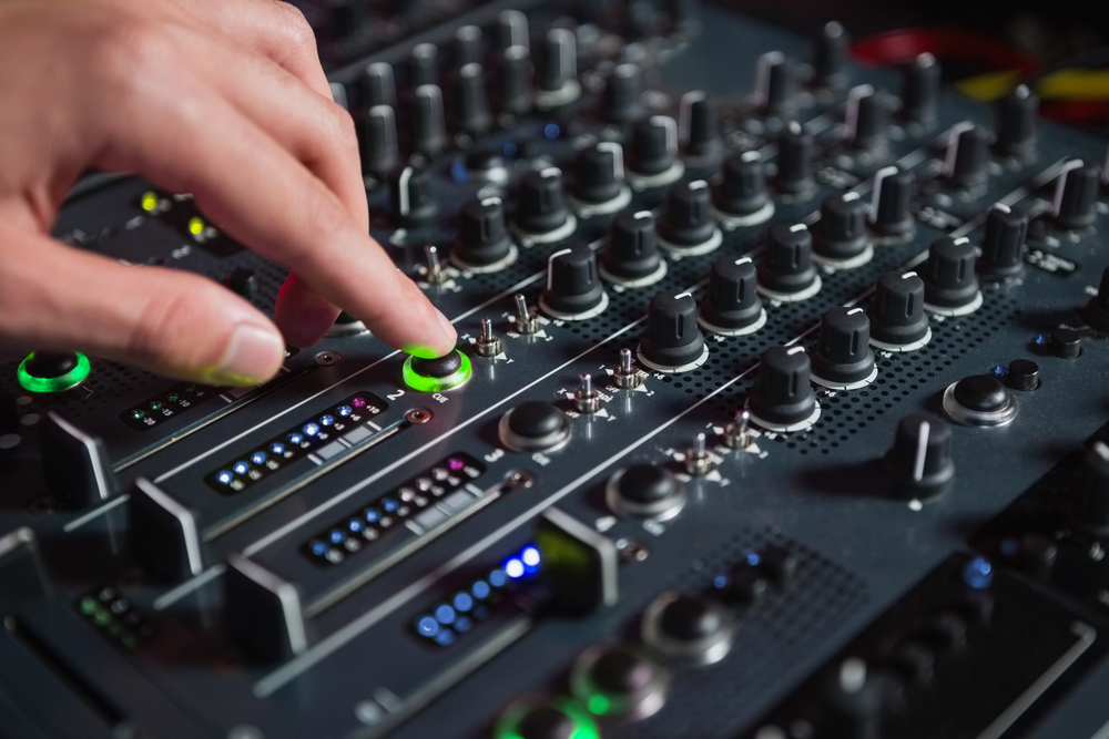 Male DJ playing music at the nightclub